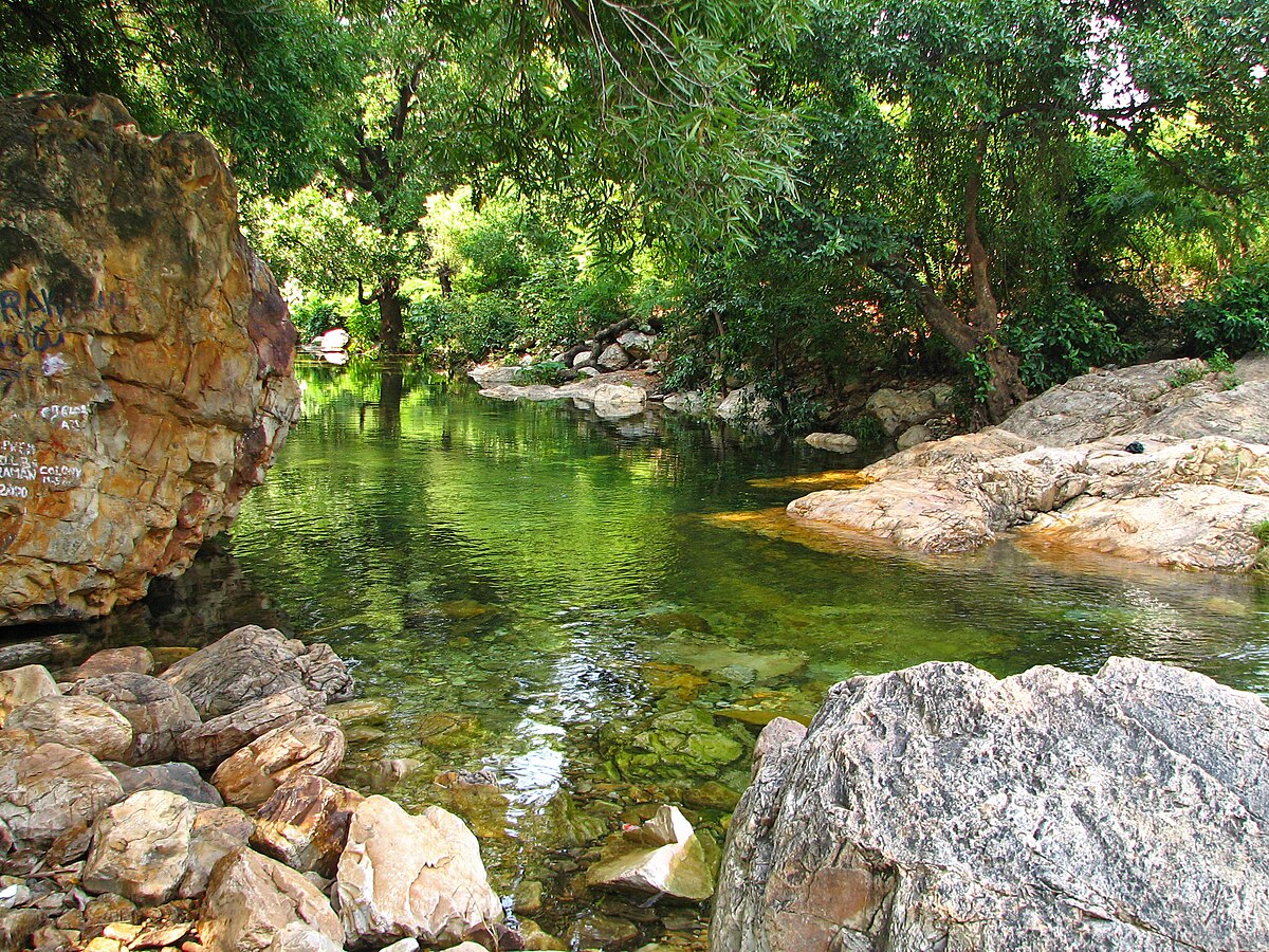 Trekking trail crossing a river at Tada Falls (Ubbalamadugu Falls)