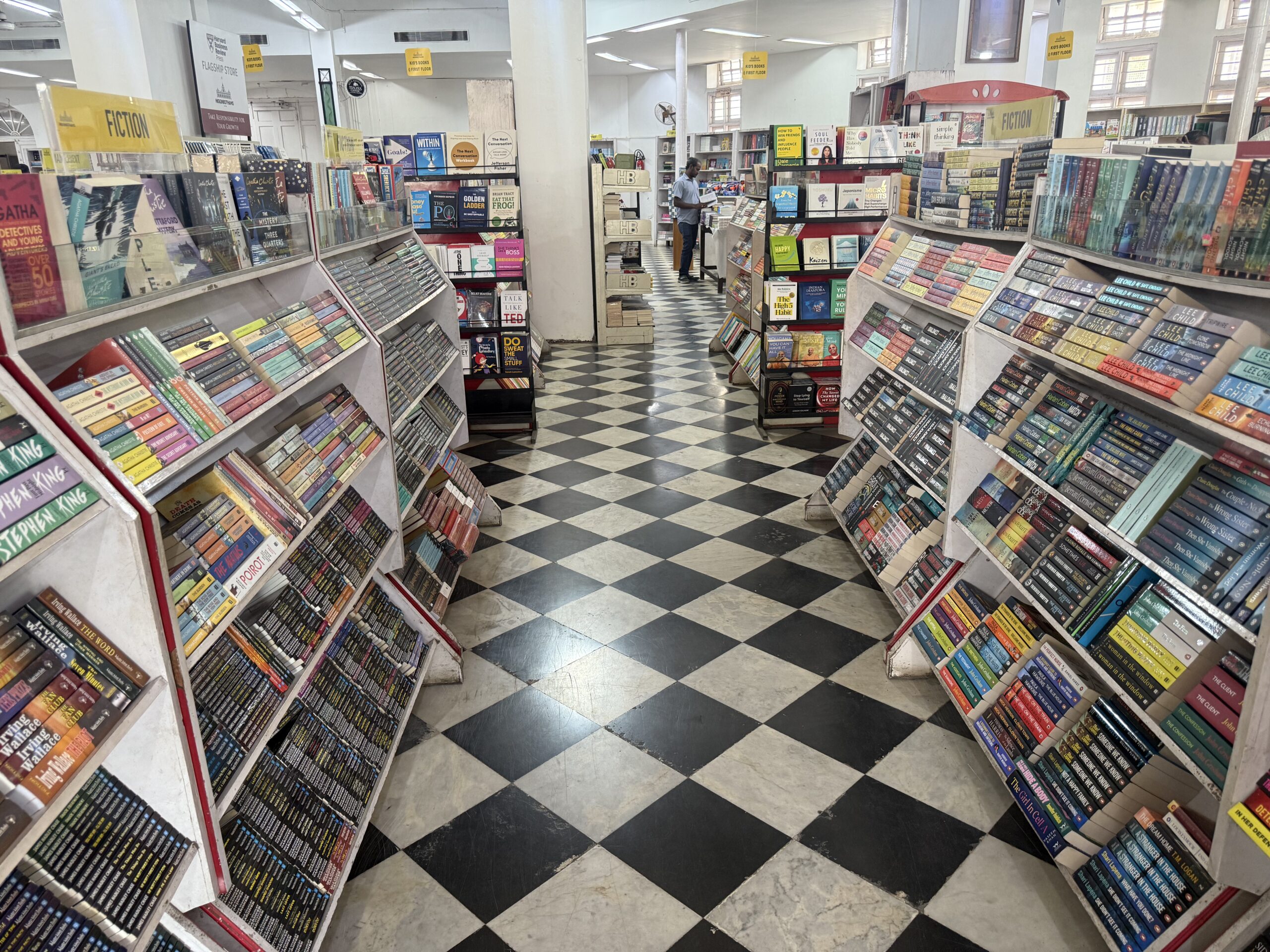 Bookshelves and heritage tiled flooring inside Higginbothams Chennai