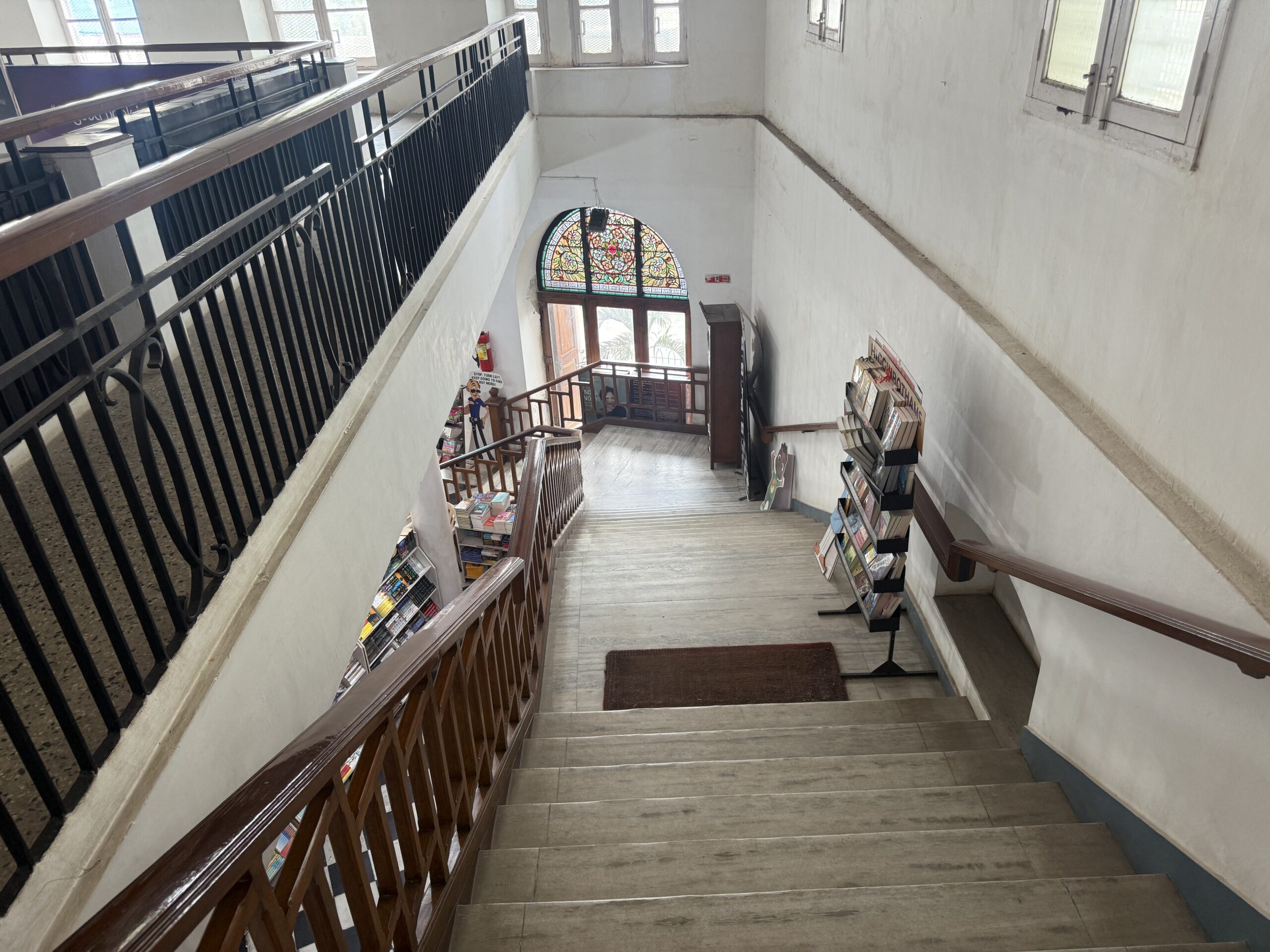 Grand wooden spiral staircase inside Higginbothams Mount Road Chennai