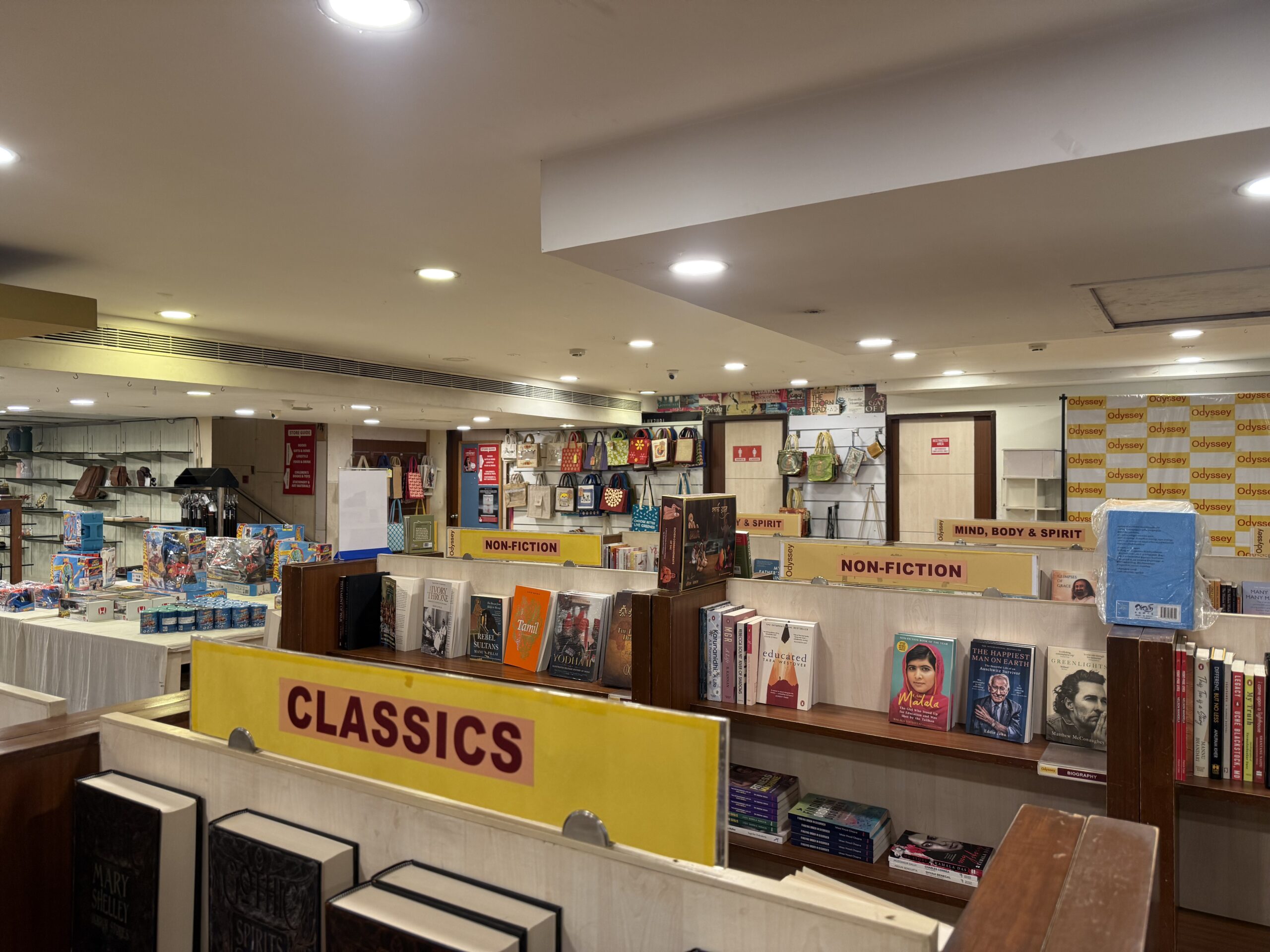 Spacious book collection across multiple floors at Odyssey Adyar Chennai